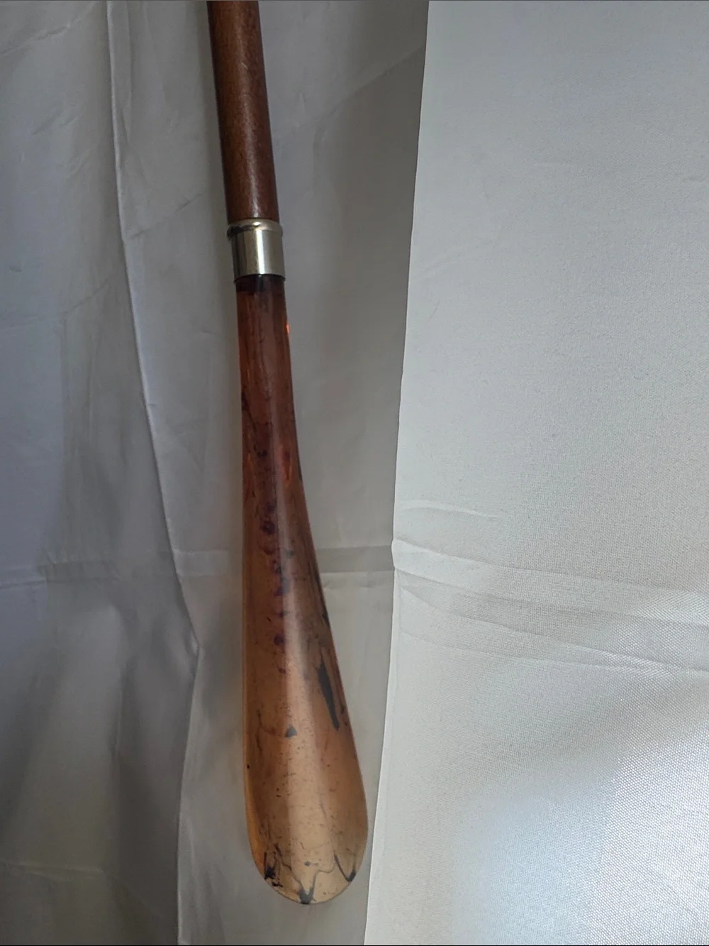 Decorative shoe horn made in Italy. Horse head/metal, wooden shaft, plastic.